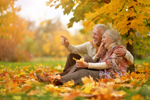 Older couple enjoying fall pain while preventing back pain