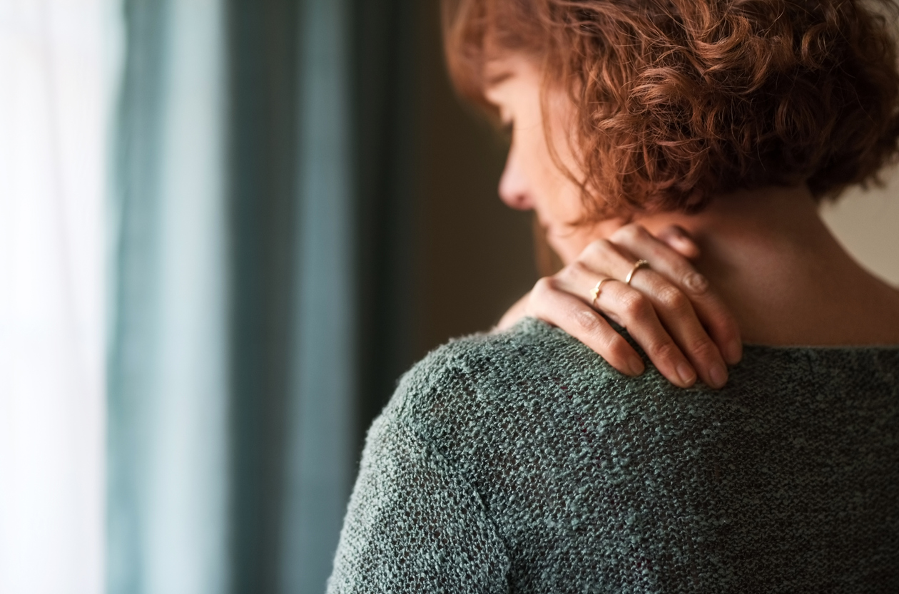 Woman with myalgia pain in shoulder
