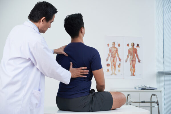 spinal cord stimulation doctor with patient